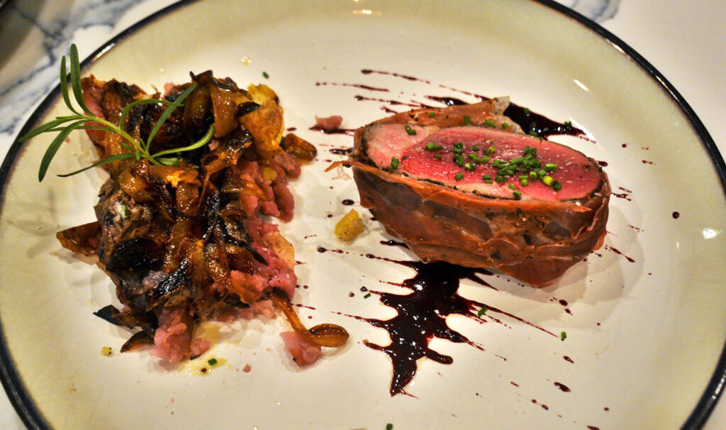 beef wellington entree served with smashed potatoes