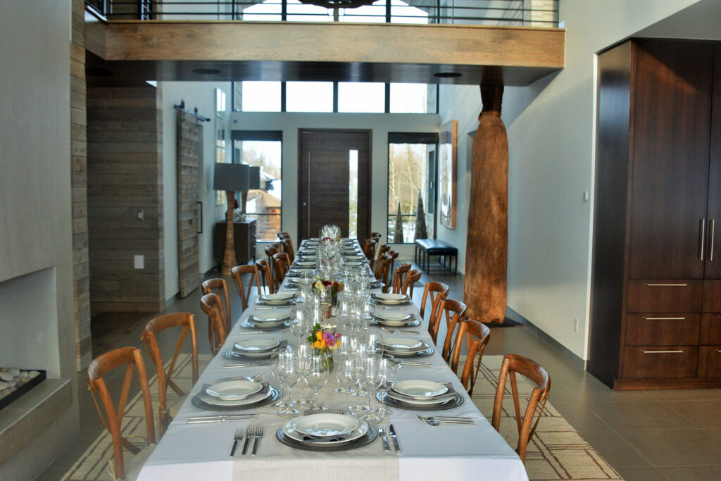 banquet room with long table setting for a large dinner party