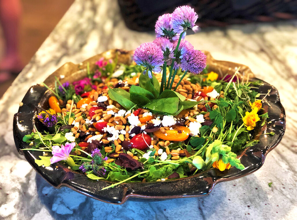 fresh salad with pine nuts, goat cheese, tomatoes